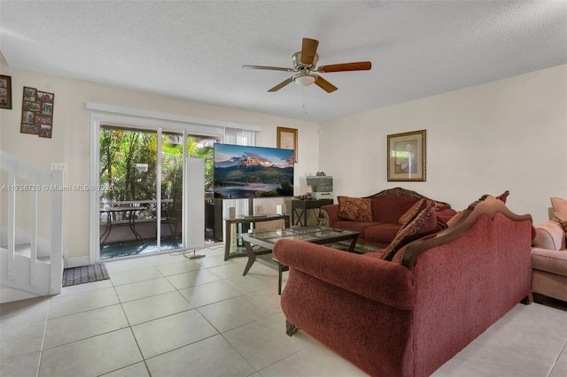 12140 Bruceton Way Unit 102, Orlando, FL 32828 - tiled living room with a textured ceiling and ceiling fan