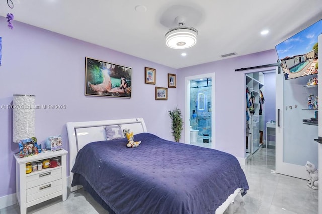 bedroom featuring visible vents, connected bathroom, baseboards, a barn door, and recessed lighting