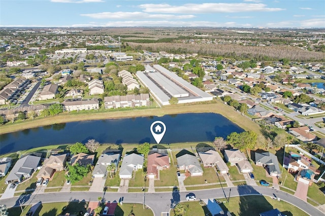 aerial view with a residential view and a water view