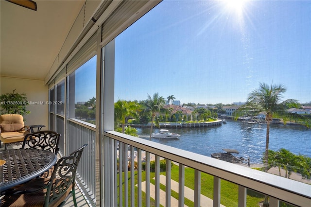 balcony featuring a water view