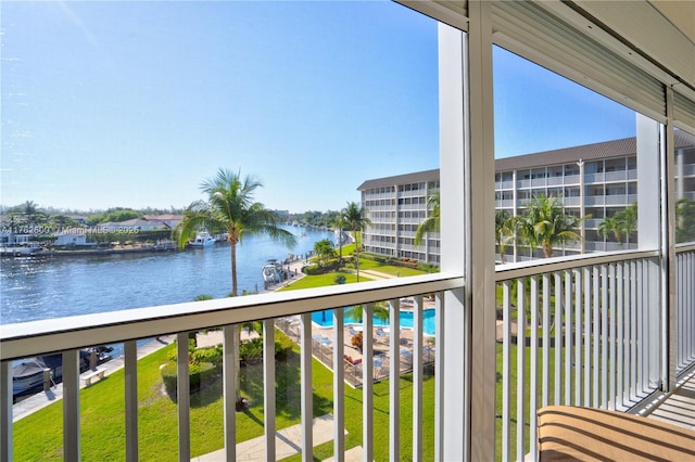 balcony featuring a water view