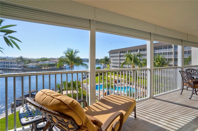 balcony featuring a water view