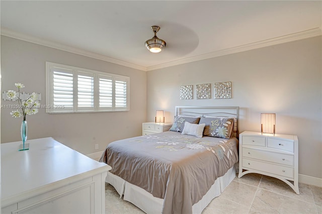 bedroom featuring baseboards and crown molding