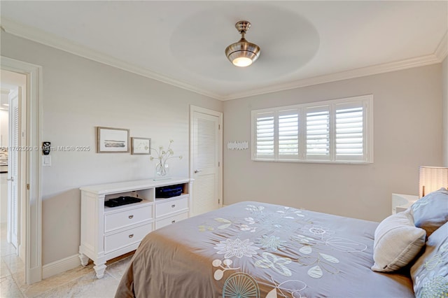 bedroom featuring light tile patterned floors, a ceiling fan, crown molding, and baseboards