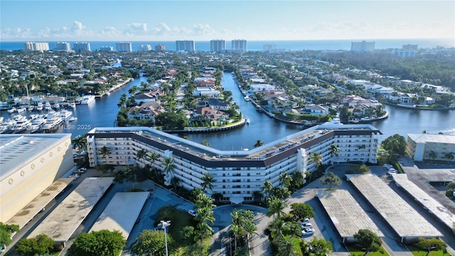 bird's eye view featuring a view of city and a water view