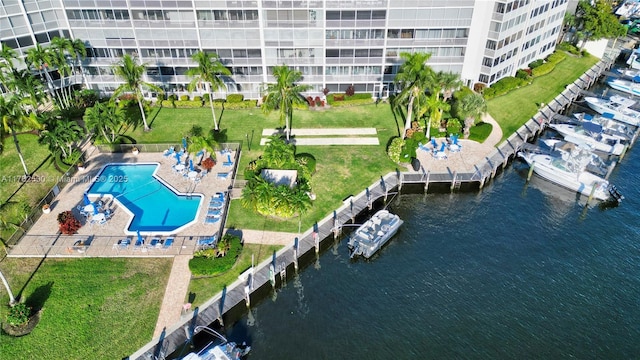 birds eye view of property with a water view