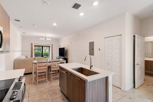 kitchen featuring a sink, visible vents, appliances with stainless steel finishes, and light countertops