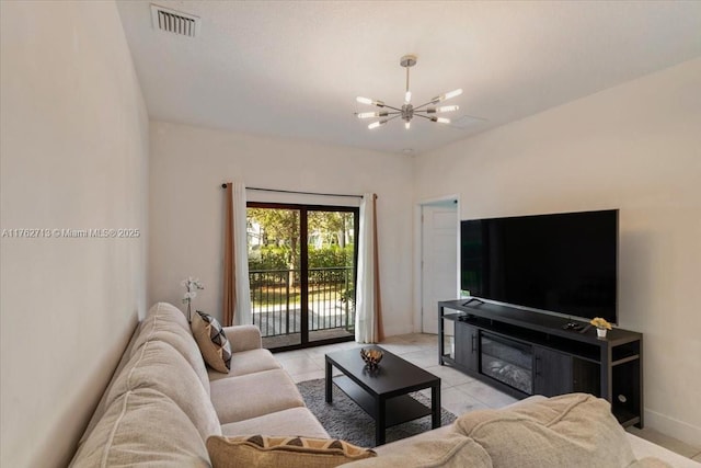 living area with light tile patterned floors, baseboards, visible vents, and a chandelier