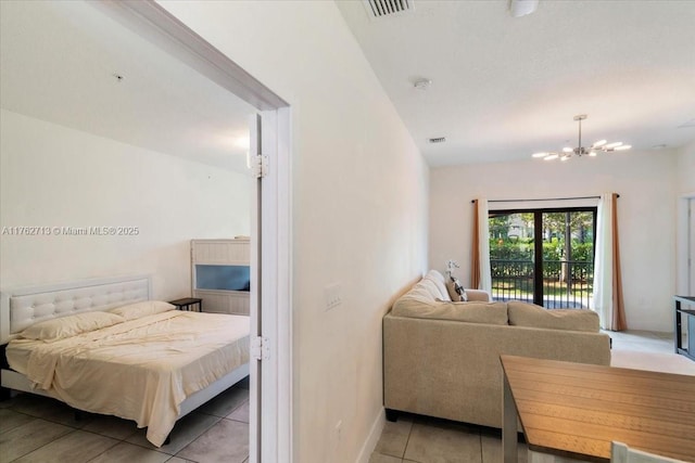 bedroom with access to exterior, a notable chandelier, light tile patterned flooring, and visible vents