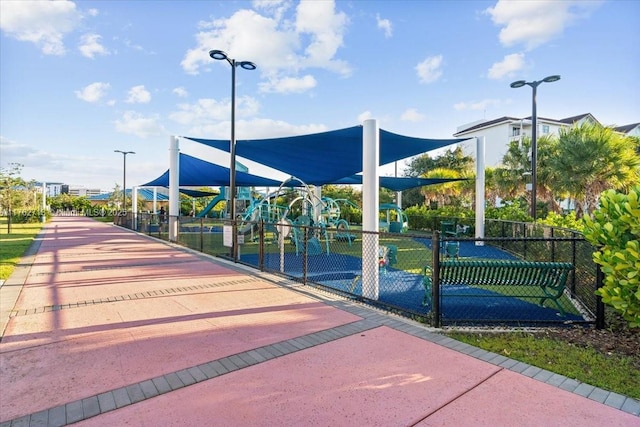 view of community with fence and playground community