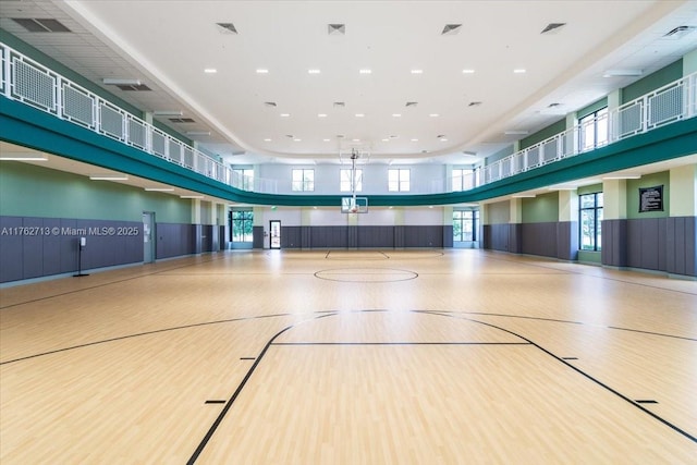 view of basketball court featuring a healthy amount of sunlight and community basketball court