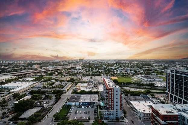 birds eye view of property with a city view