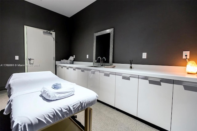 interior space with light colored carpet and a sink