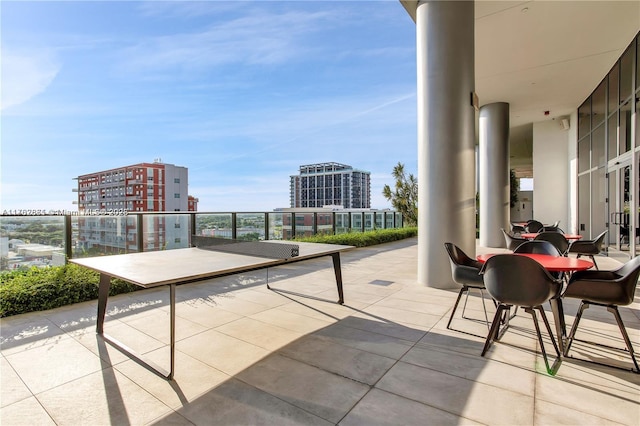 view of patio featuring a city view and a balcony