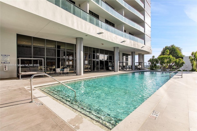 community pool with a patio area