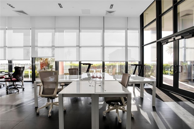 dining space with visible vents, floor to ceiling windows, and french doors