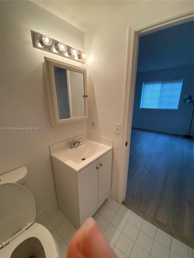 3231 Sabal Palm Mnr Unit 101, Davie, FL 33024 - half bathroom with vanity and tile patterned flooring