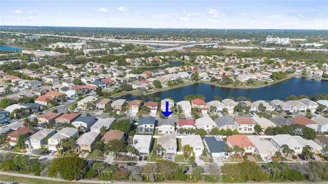 aerial view with a water view and a residential view