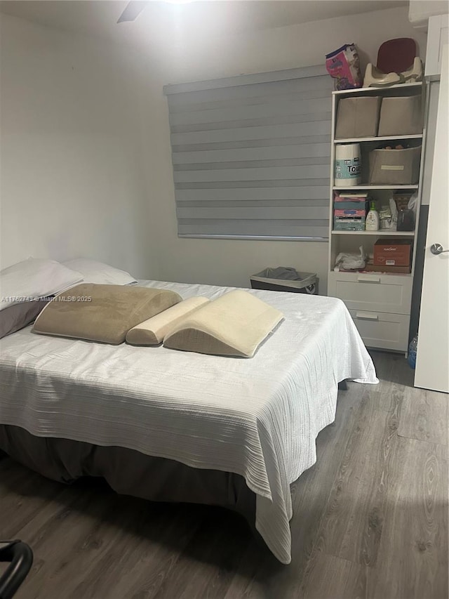 bedroom with wood finished floors