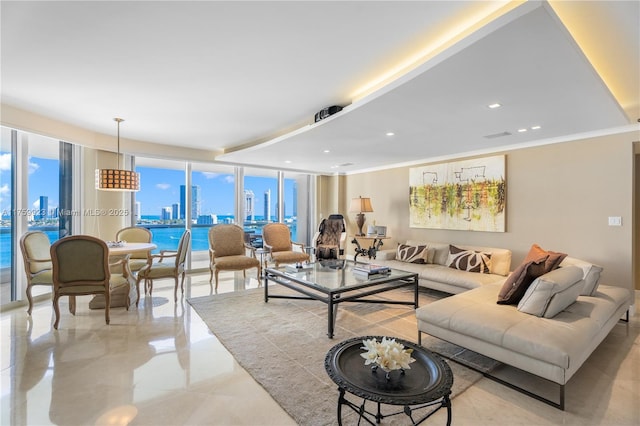 living room with a wall of windows, a city view, recessed lighting, and crown molding