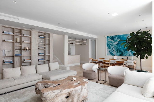 living area with wood finished floors and baseboards