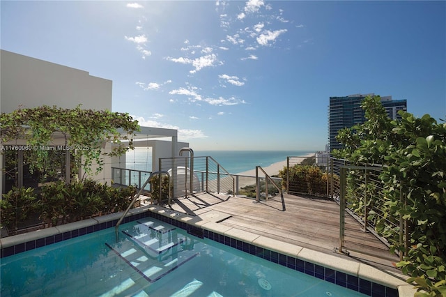 view of swimming pool with a water view