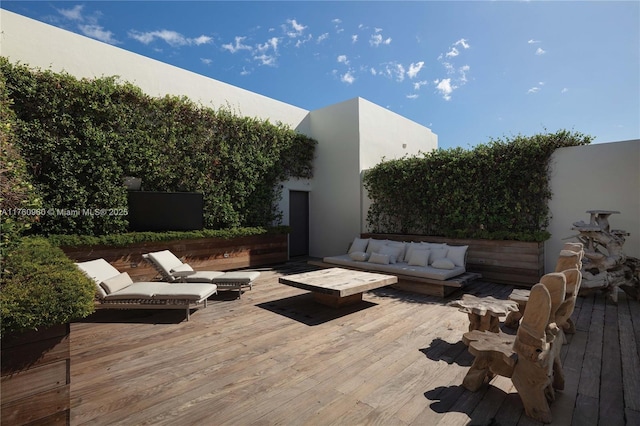 wooden deck featuring an outdoor hangout area