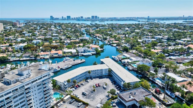 drone / aerial view with a view of city and a water view