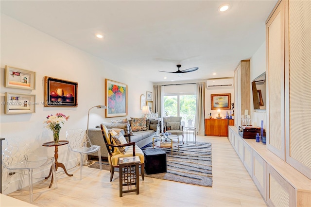 living area with a wall unit AC, recessed lighting, light wood finished floors, and ceiling fan