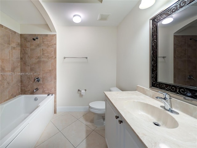 bathroom with vanity, baseboards, tile patterned flooring, bathing tub / shower combination, and toilet