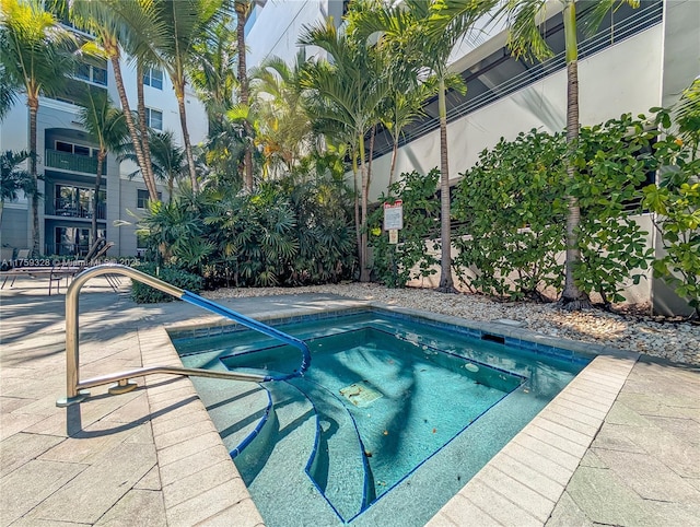 view of pool featuring a hot tub