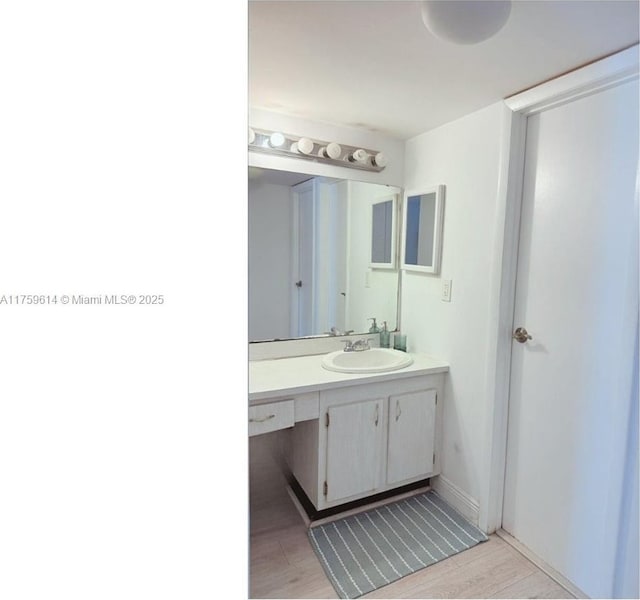 3101 N Country Club Dr Unit 209, Aventura, FL 33180 - bathroom featuring vanity and wood finished floors