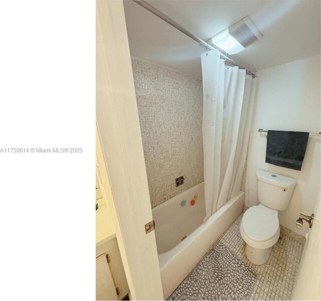 3101 N Country Club Dr Unit 209, Aventura, FL 33180 - bathroom featuring toilet, tile patterned floors, and shower / tub combo