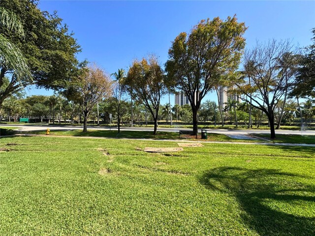 3101 N Country Club Dr Unit 209, Aventura, FL 33180 - surrounding community with a lawn