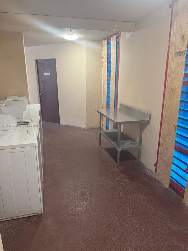 3101 N Country Club Dr Unit 209, Aventura, FL 33180 - corridor with washer and clothes dryer and concrete floors