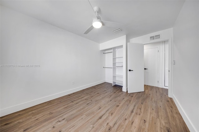 unfurnished bedroom with light wood-style floors, visible vents, a closet, and baseboards