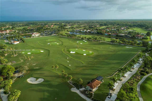 birds eye view of property with golf course view