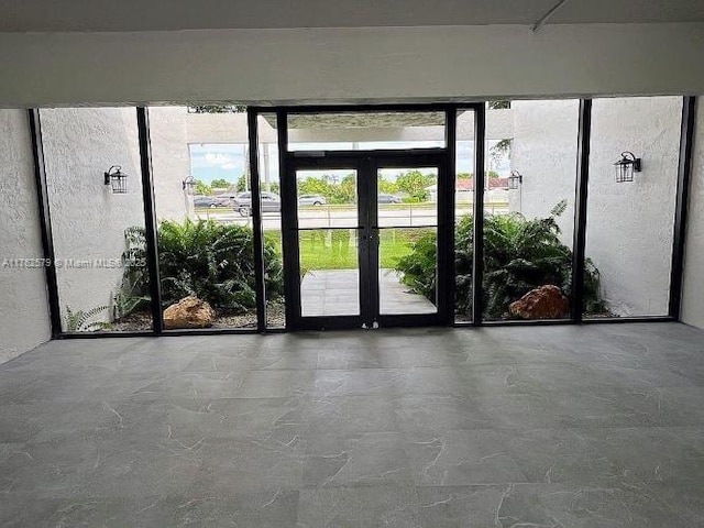 doorway to outside featuring french doors and plenty of natural light