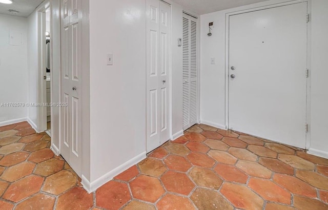 foyer entrance with baseboards