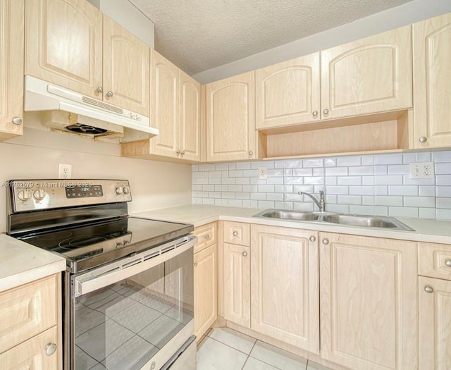 kitchen with electric range, light brown cabinets, and under cabinet range hood