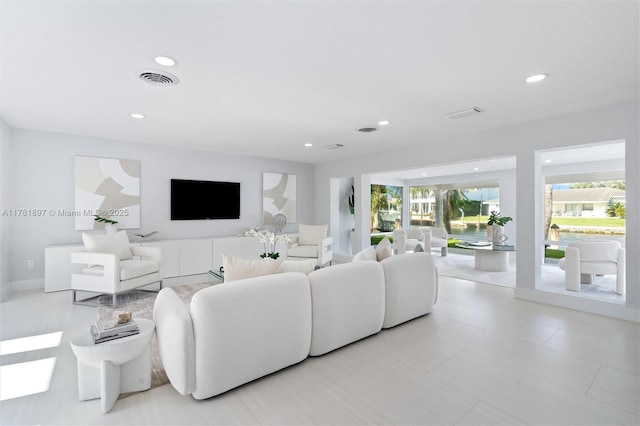 living area with recessed lighting and visible vents