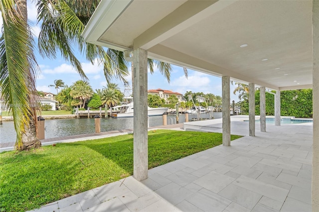 view of patio with an outdoor pool, a dock, and a water view