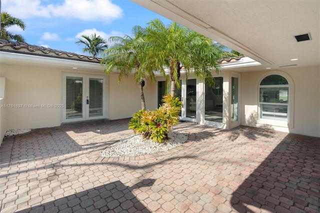 view of patio featuring french doors