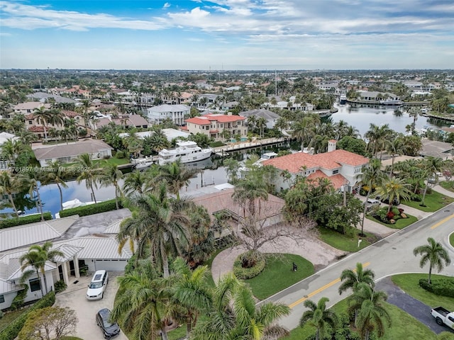 bird's eye view with a residential view and a water view