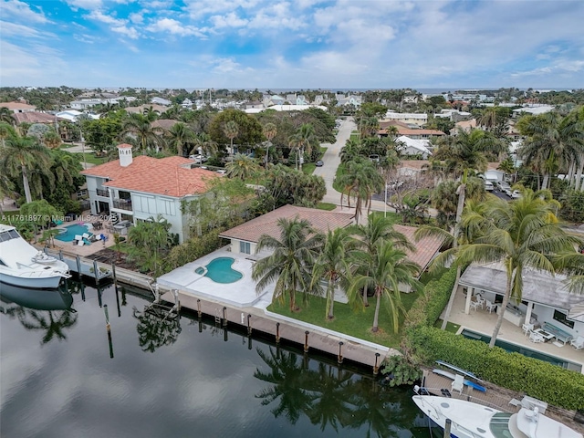 drone / aerial view featuring a residential view and a water view