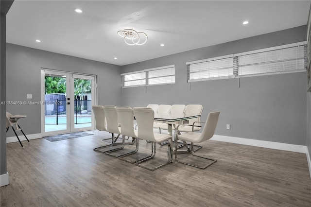 dining area with wood finished floors, recessed lighting, french doors, and baseboards