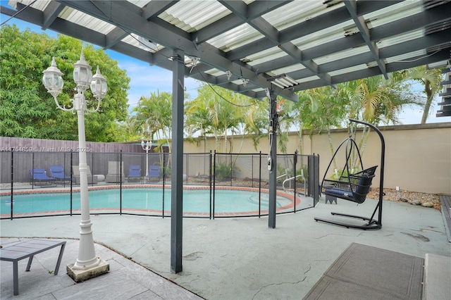 view of pool featuring a fenced in pool, a patio, and fence