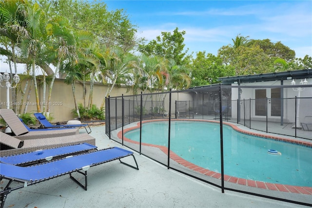 view of pool with a patio, fence, and a fenced in pool