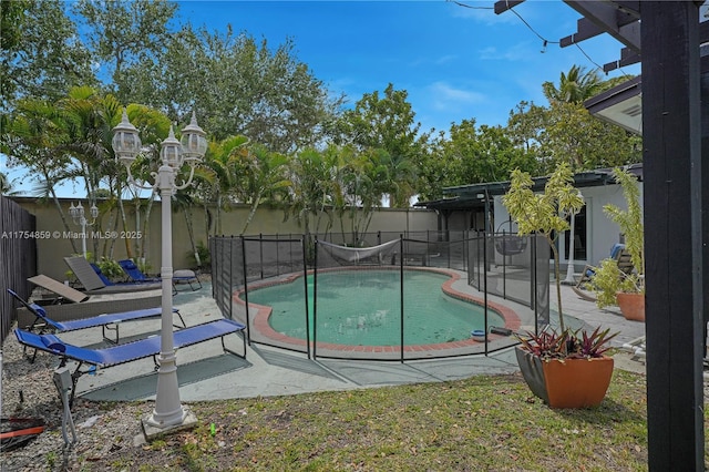 view of pool featuring a fenced in pool, a patio area, and fence