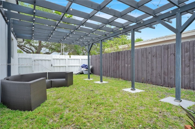 view of yard with a fenced backyard and a pergola